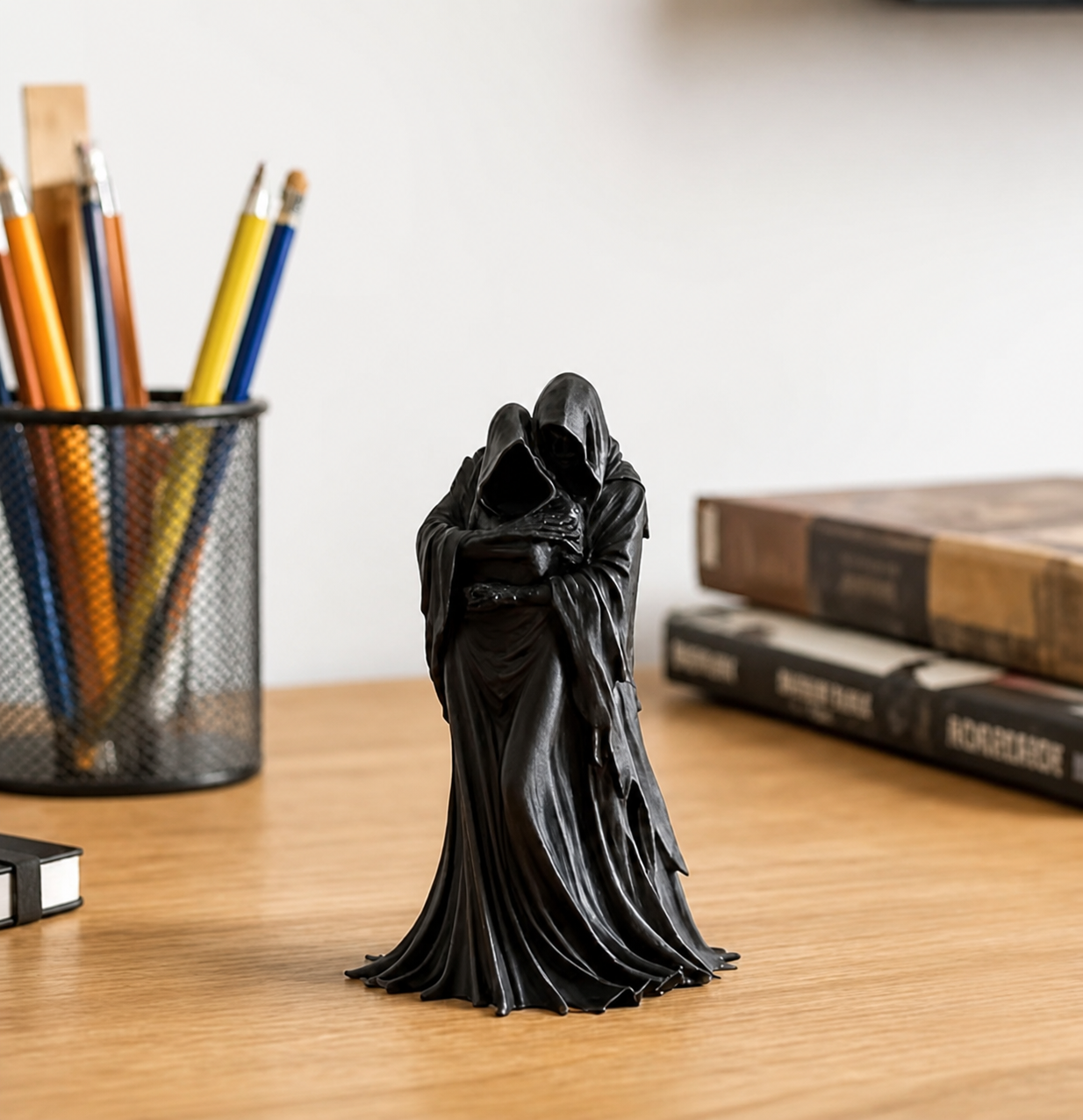 Small black decorative statue in a home setting