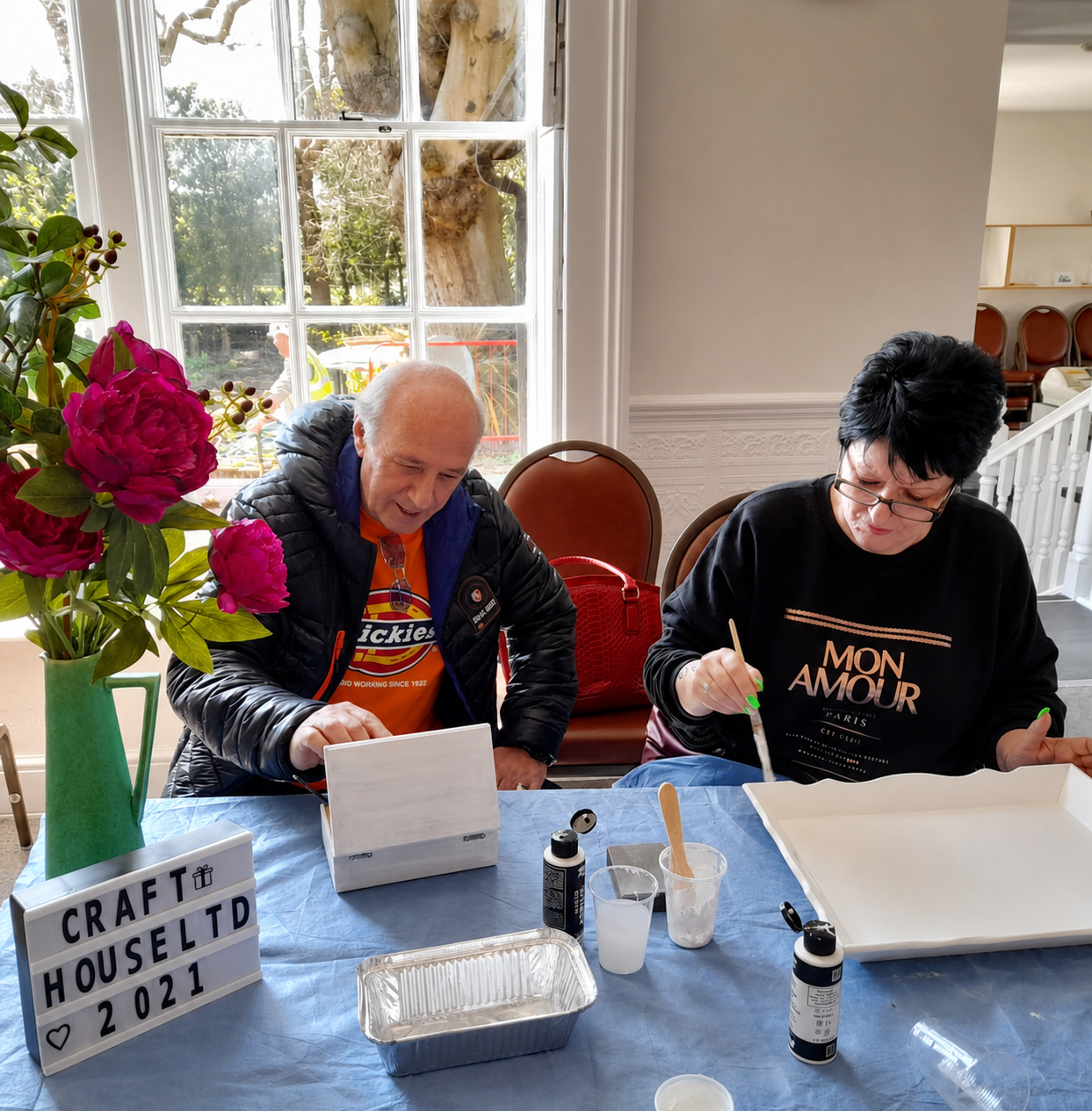Adults enjoying a craft session