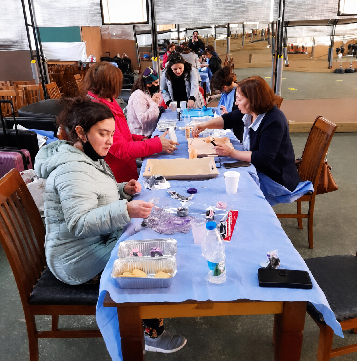 People gathered around a craft table during a workshop