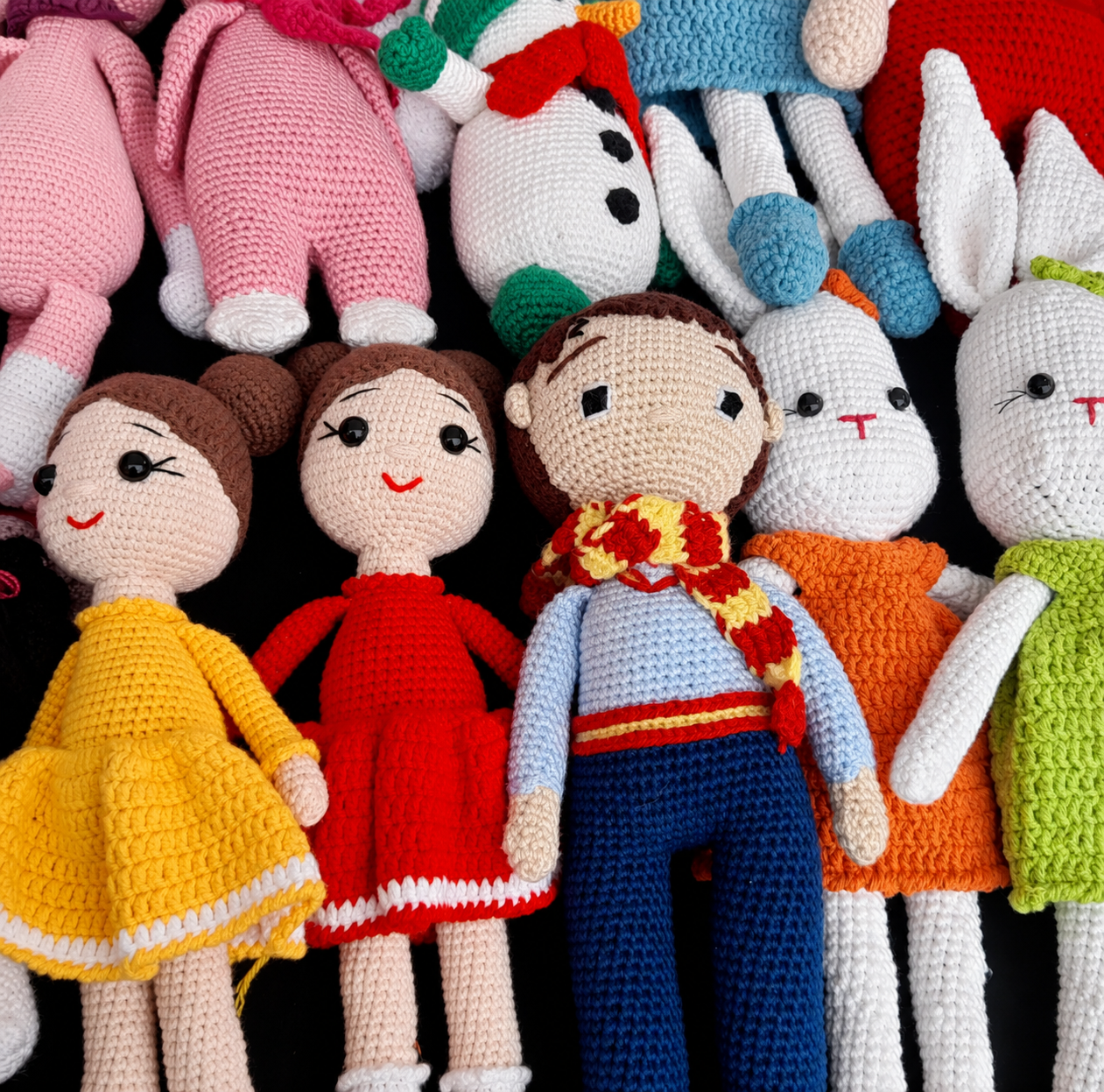 A collection of handmade cotton dolls