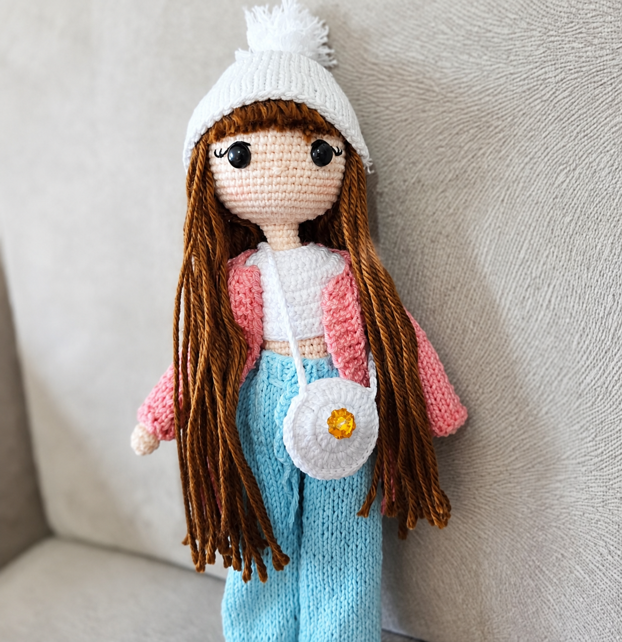 Handmade crochet fashion doll in a knitted outfit