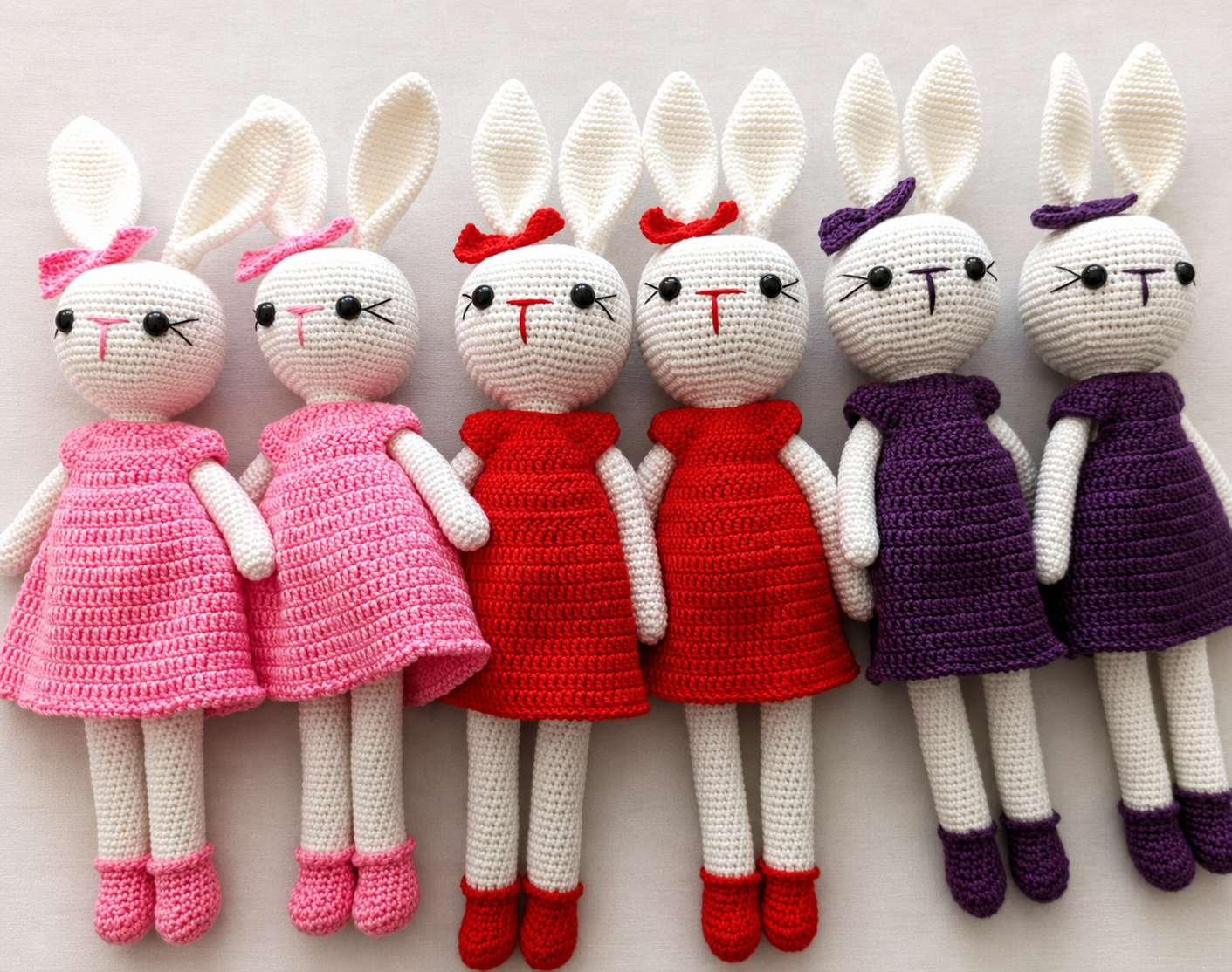 A collection of colourful handmade crochet rabbits