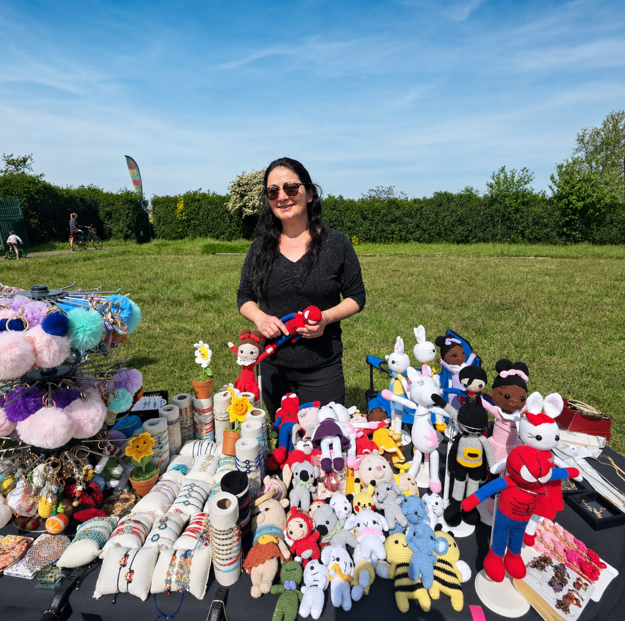Meltem standing behind her colourful handmade crochet market stall